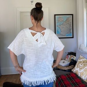 Nubby cotton top with tie-back and darling tassel trim. Doe & Rae
